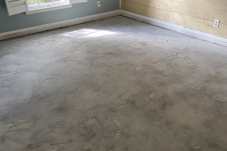 bedroom after hardwood floor is removed.