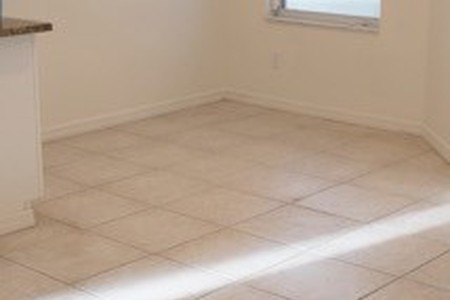 tile floor in a breakfast nook before removal process