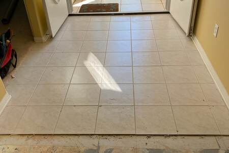 before tile removal of entryway in viera home