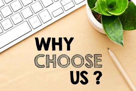 Keyboard and plant with a "why choose us?" graphic 